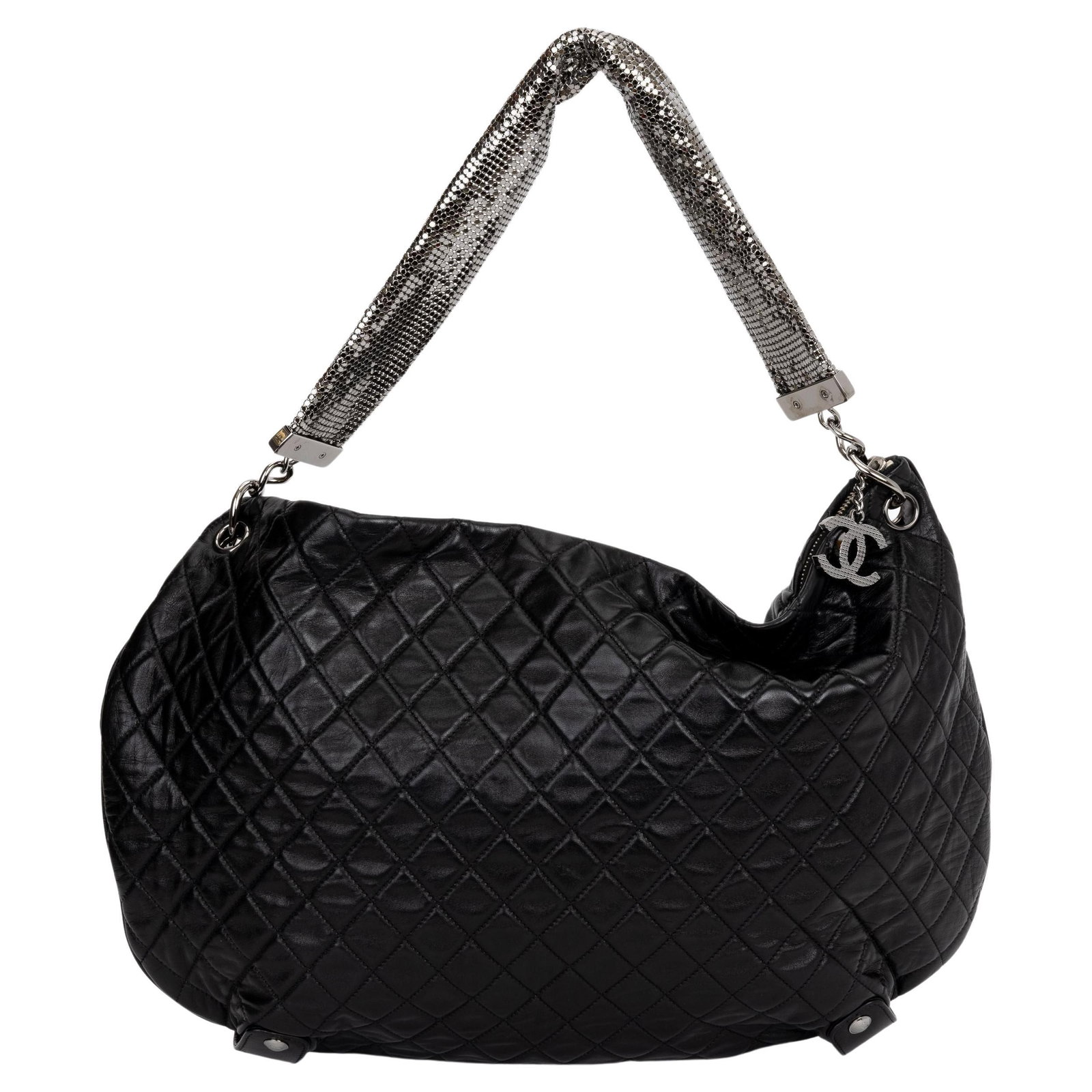 Chanel Black Quilted Lambskin Chain Mail Hobo Bag Collection 12: Chanel Black Quilted Lambskin Chain Mail Hobo Bag Collection 12 Elevate your accessory collection with the Chanel Black Mesh Chain Mail Bag. This exquisite bag is crafted from luxurious black quilted 