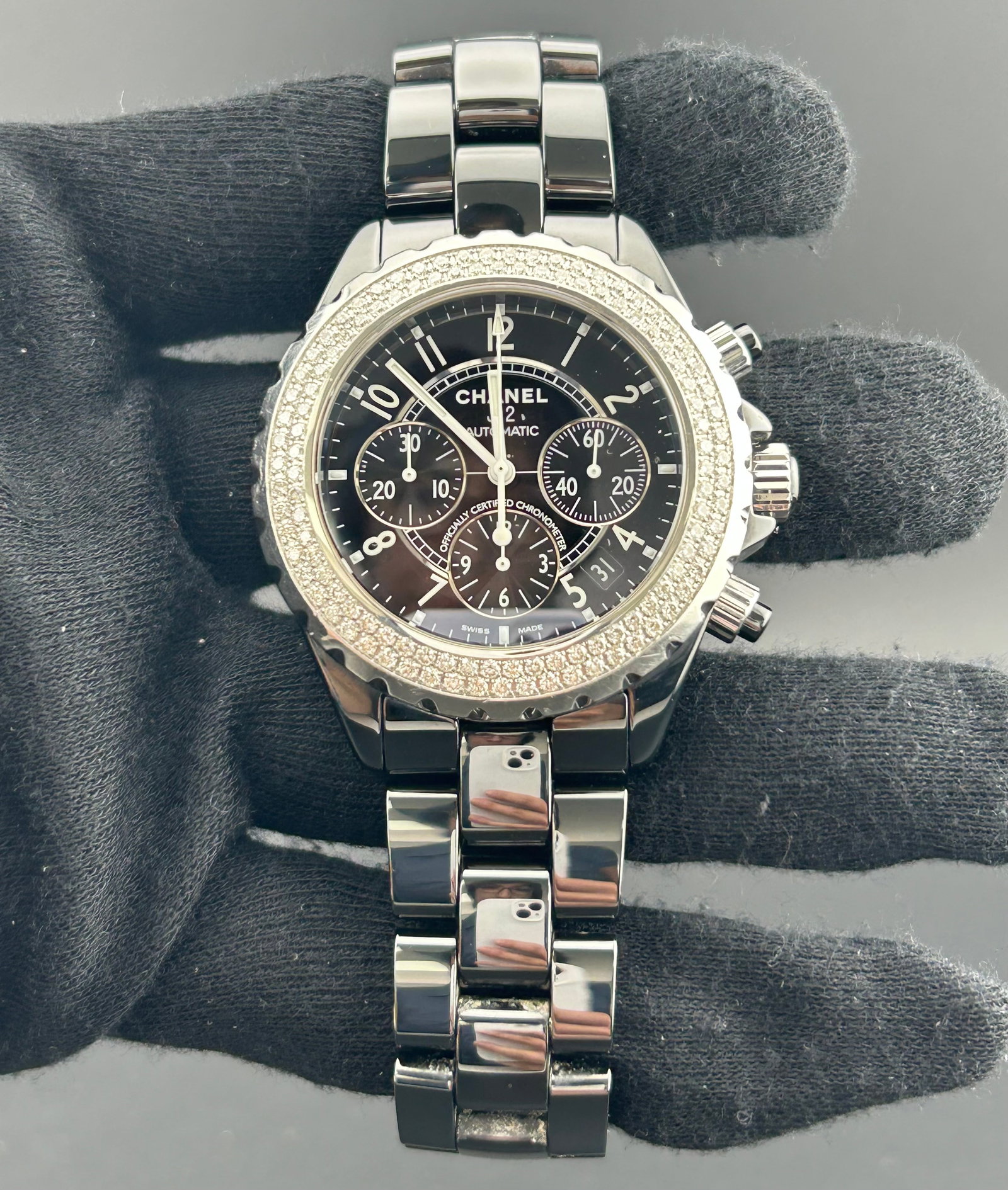 Chanel J12 H1009 mens ceramic watch with black dial: Chanel J12 H1009 mens ceramic watch with black dial Chanel J12 men's watch with a black dial, diamond bezel, and ceramic bracelet. Reference number H1009. Specifications Gender: Mens Category: OG Refe