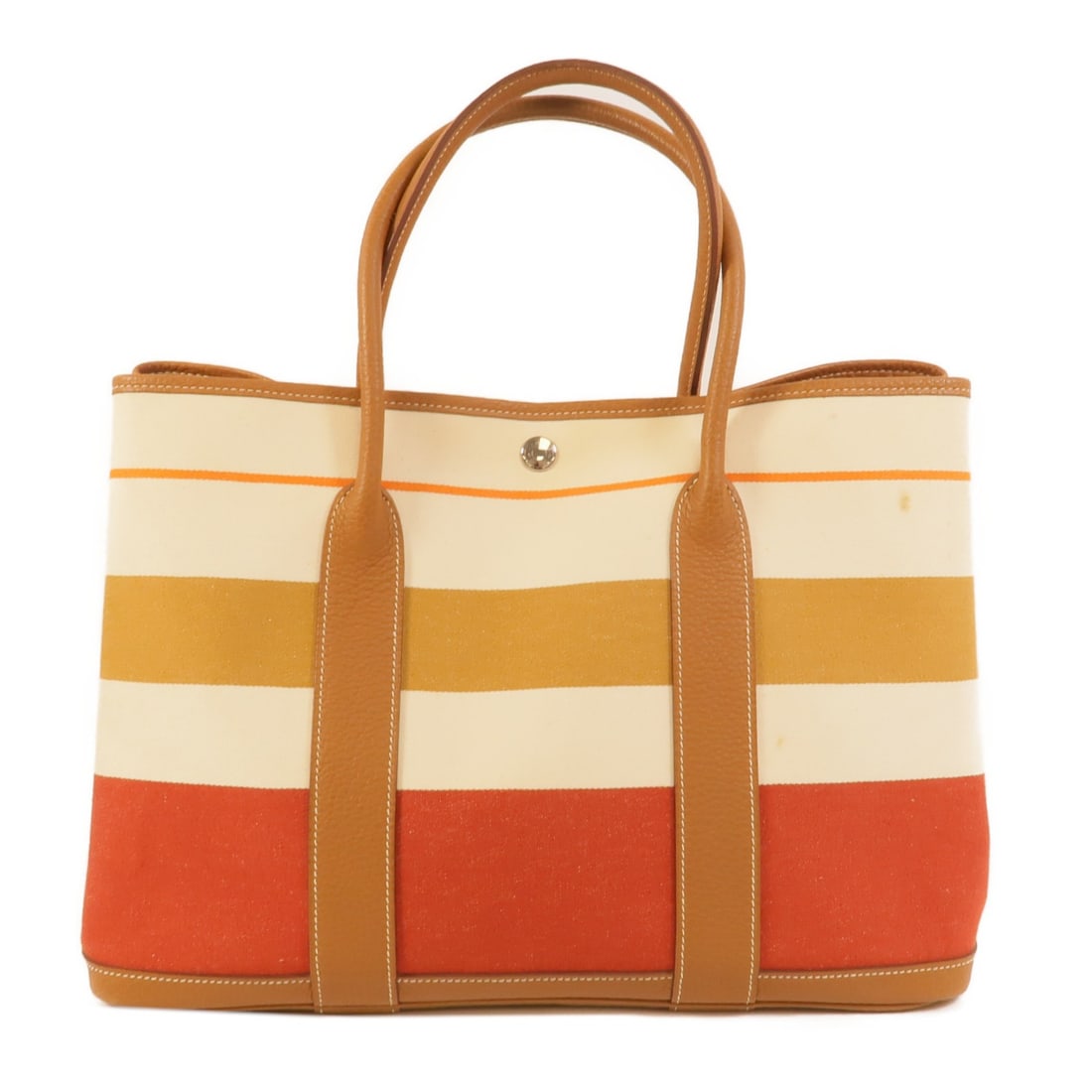 Canvas PM Tote Hermes Garden Party Multicolor Bag: Canvas PM Tote Hermes Garden Party Multicolor Bag Hermes Garden Party PM handbag in canvas with a multicolor design in brown, red, and ivory. It features a hook button closure, one inside zip pocket, 