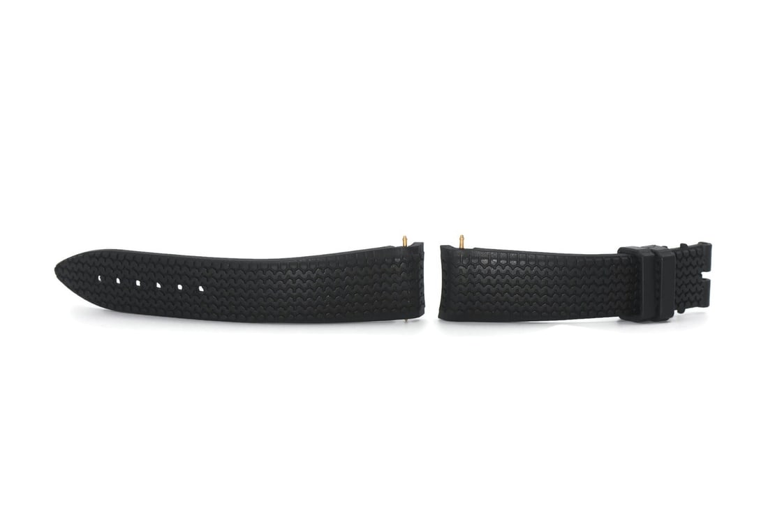 Chopard 21mm Black Rubber Wristwatch Band: Chopard 21mm Black Rubber Wristwatch Band This is a pre-owned Chopard black rubber strap designed for wristwatches. The strap is made from durable rubber and features a width of 21 mm at the lugs and 