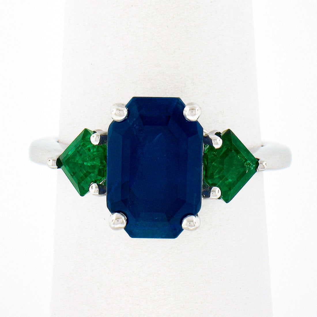 Platinum 5.32ctw Gubelin Sapphire Emerald Cut Engagement Ring: Platinum 5.32ctw Gubelin Sapphire Emerald Cut Engagement Ring This exquisite engagement ring is a stunning combination of elegance and craftsmanship, featuring a captivating Gubelin certified elongate