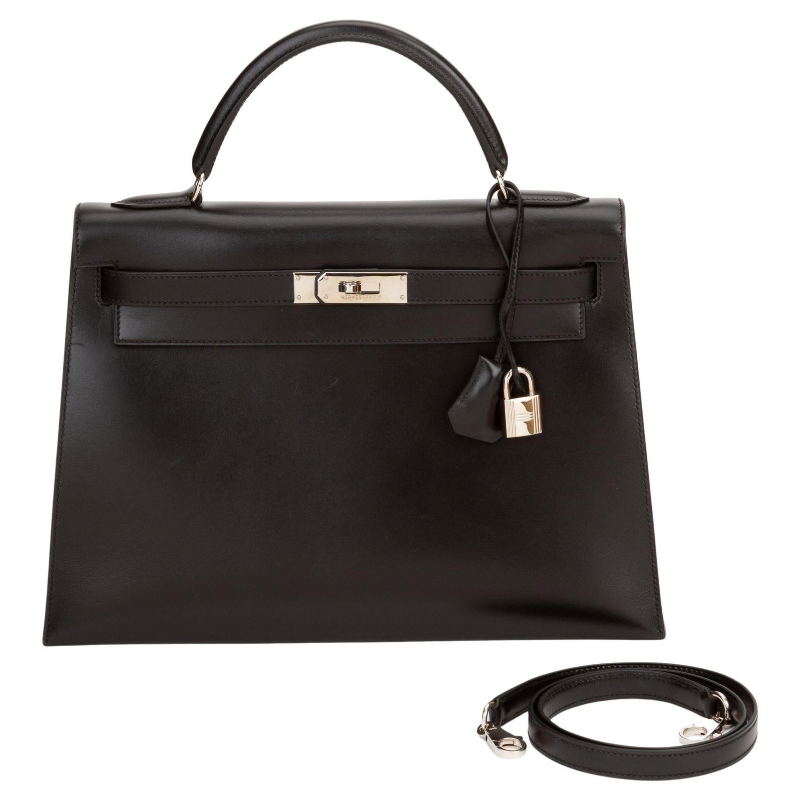 Hermes Kelly 32 Noir Sellier Box Calf Palladium Hardware: Hermes Kelly 32 Noir Sellier Box Calf Palladium Hardware This Hermes Kelly 32 Sellier handbag in Noir is crafted from Box Calf leather and features palladium hardware. The bag includes a single rolled