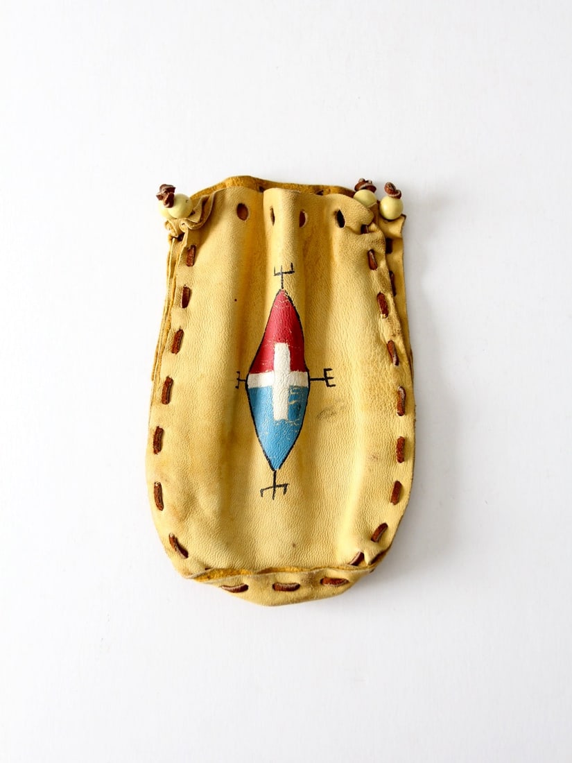 Vintage Hand-Painted Deerskin Pouch with Red White Blue Design: Vintage Hand-Painted Deerskin Pouch with Red White Blue Design This vintage hand-painted deerskin pouch is a unique accessory that combines artistry and functionality. Crafted from soft and supple dee