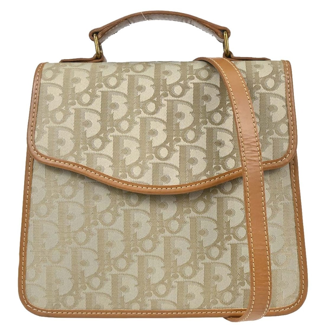 Dior Trotter beige canvas satchel with shoulder strap: Dior Trotter beige canvas satchel with shoulder strap Christian Dior Trotter 2way handbag in beige canvas with brown top handles and a removable shoulder strap. This women's satchel/top handle bag fea