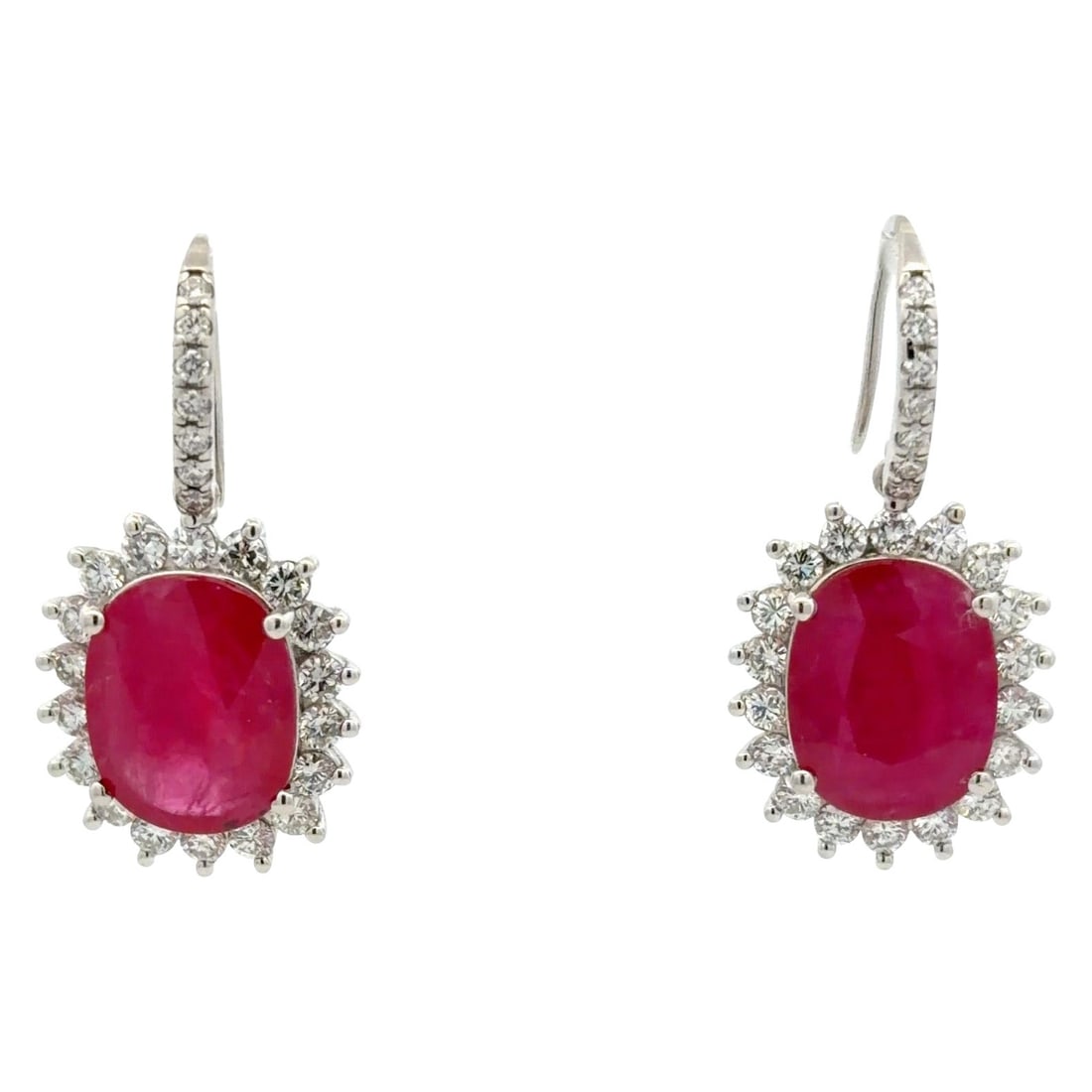 Oval Ruby and Diamond Halo Drop Earrings in 14K White Gold 15.27ct Rubies: Oval Ruby and Diamond Halo Drop Earrings in 14K White Gold 15.27ct Rubies These halo drop earrings feature two oval-cut natural rubies with a combined weight of approximately 15.27 carats, each surrou