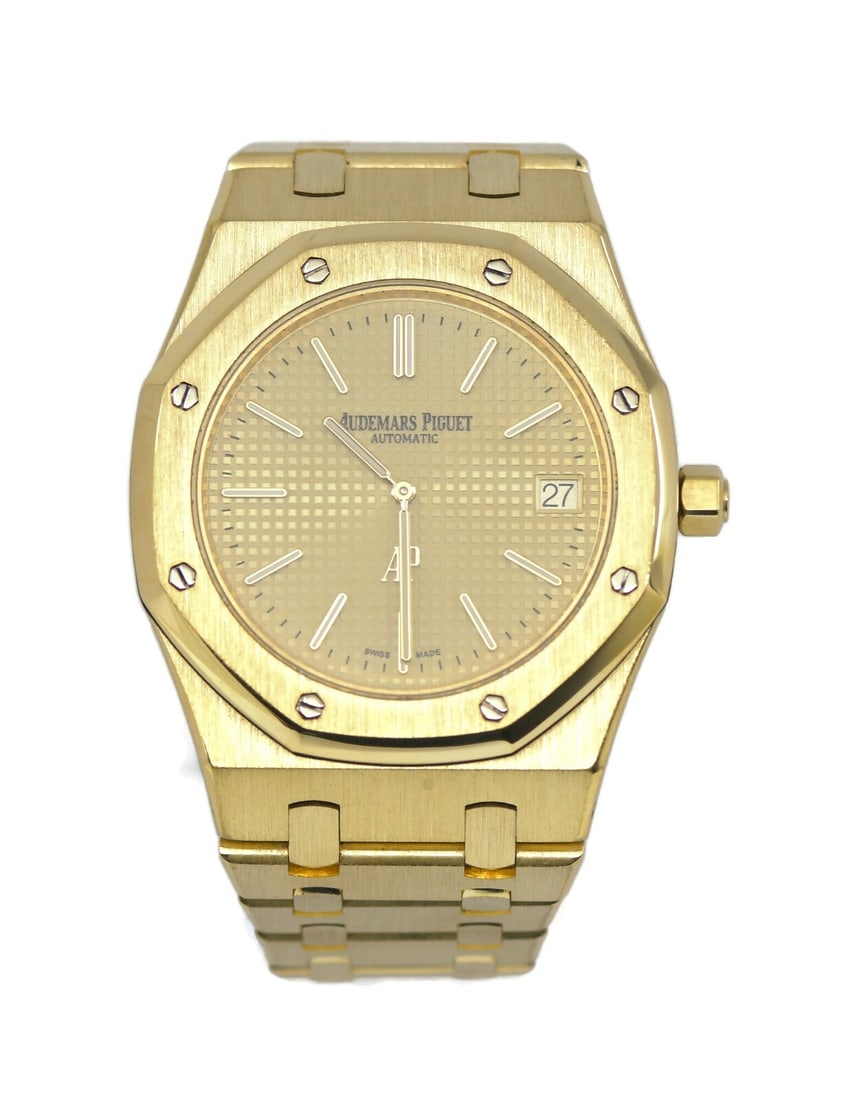 Audemars Piguet Royal Oak 18K Yellow Gold Watch 15202BA with Box: Audemars Piguet Royal Oak 18K Yellow Gold Watch 15202BA with Box Experience the elegance of the Audemars Piguet Royal Oak Extra Thin, crafted in luxurious 18K yellow gold. This exquisite wristwatch fe