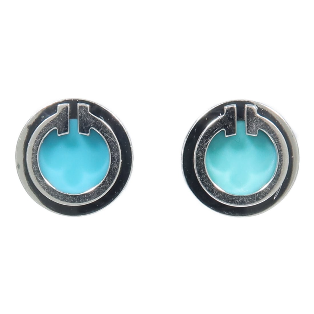 Tiffany Co T Turquoise Circle Earring 18K White Gold Blue: Tiffany Co T Turquoise Circle Earring 18K White Gold Blue Tiffany & Co. T Turquoise Circle Earring in 18K white gold with a blue finish. This unisex earring is described as a regular size item and com