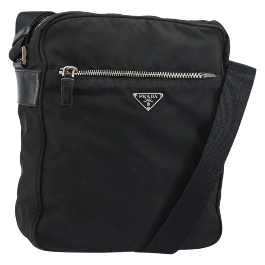 Prada Tessuto Nylon Messenger Bag with Saffiano Leather Accents: Prada Tessuto Nylon Messenger Bag with Saffiano Leather Accents The Prada Front Pocket Zip Messenger Bag is crafted from durable black nylon with Saffiano leather accents. Designed for unisex use, thi