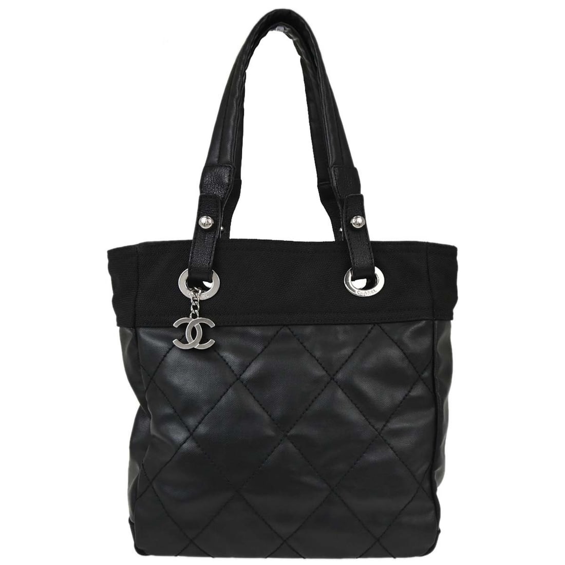 CHANEL Paris-Biarritz PM Black Canvas Zip Tote Bag: CHANEL Paris-Biarritz PM Black Canvas Zip Tote Bag Chanel Paris-Biarritz Tote PM handbag in black canvas with double handles and zip closure. This medium tote features logo accents and inner pockets f