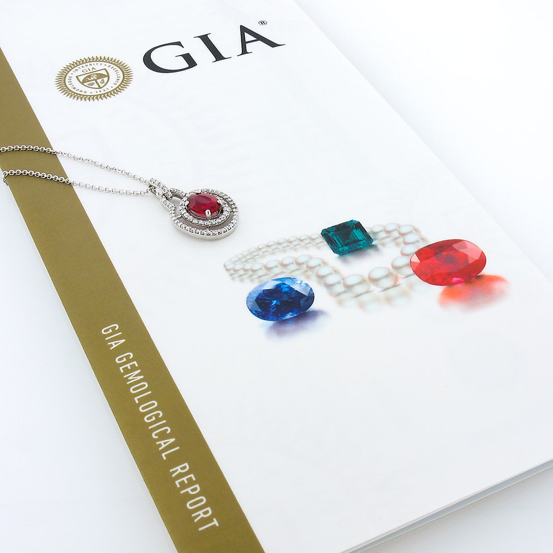 GIA Burma Cherry Red Spinel Diamond Halo 14K White Gold Pendant Necklace: GIA Burma Cherry Red Spinel Diamond Halo 14K White Gold Pendant Necklace This elegant pendant necklace features a natural, GIA-certified cherry red Spinel from Burma, set in solid 14K white gold. The 