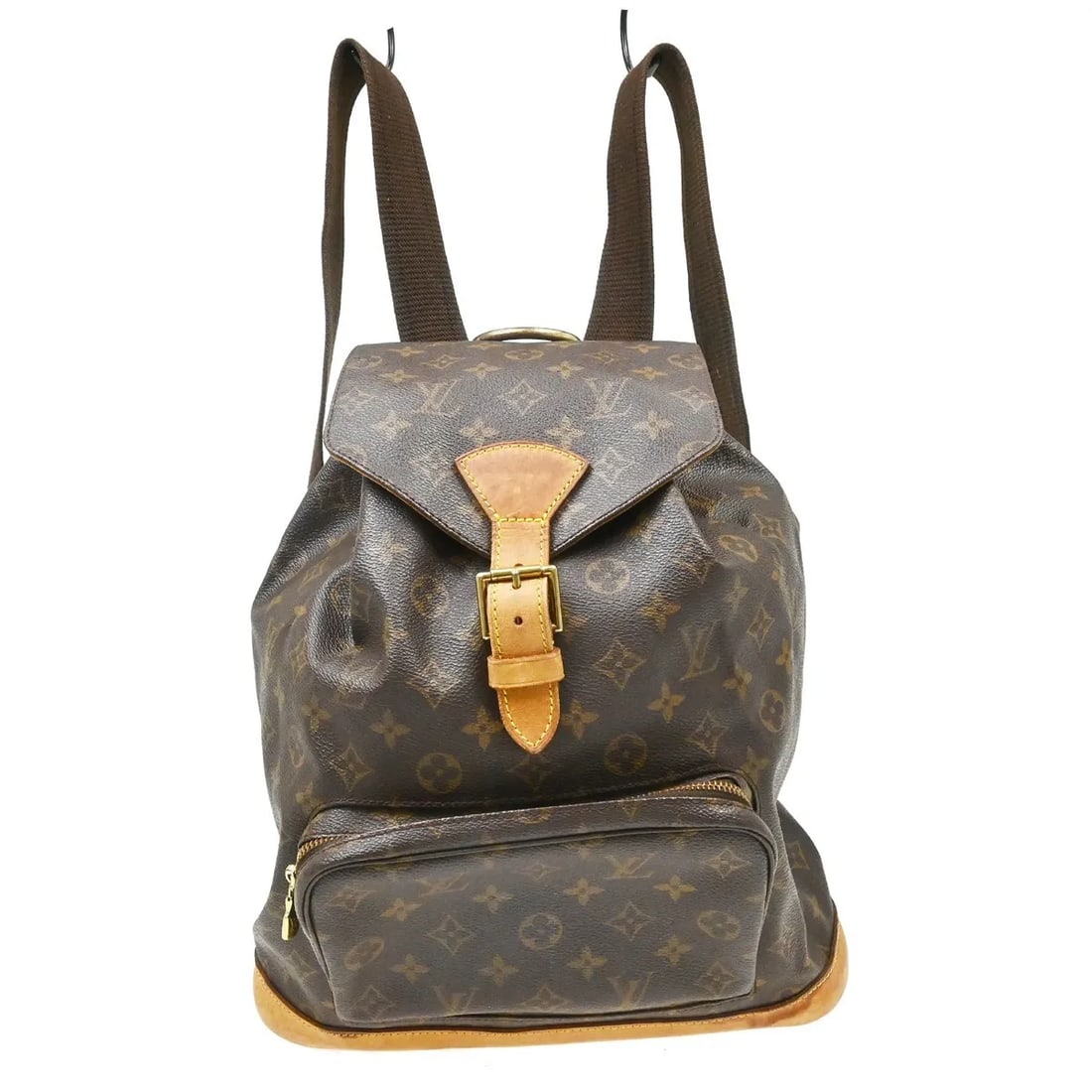 Louis Vuitton Vintage Montsouris Monogram Canvas Backpack: Louis Vuitton Vintage Montsouris Monogram Canvas Backpack Vintage Louis Vuitton Montsouris backpack in brown monogram canvas. This unisex piece is made in France and remains in fair overall condition,