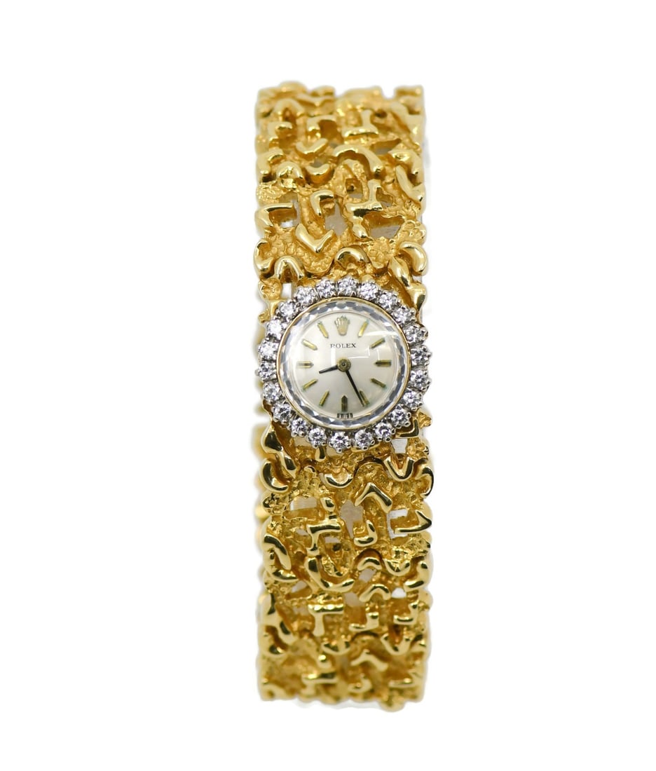 Rolex Cocktail Diamond 14K Yellow Gold Wristwatch with Papers: Rolex Cocktail Diamond 14K Yellow Gold Wristwatch with Papers This exquisite Rolex Cocktail Diamond wristwatch is a stunning piece crafted from 14K yellow gold. Manufactured between 1950 and 1959, it 