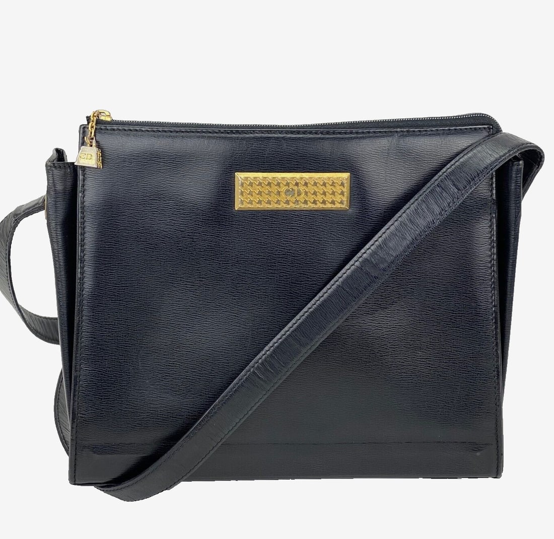 Christian Dior Black Leather Shoulder Bag with Adjustable Strap: Christian Dior Black Leather Shoulder Bag with Adjustable Strap This elegant Christian Dior bag is crafted from high-quality black leather, featuring a classic rectangular shape. The bag is equipped w