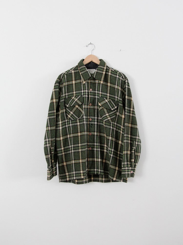 1970s JC Penney Wool Plaid Shirt Green Black Yellow: 1970s JC Penney Wool Plaid Shirt Green Black Yellow This vintage 1970s JC Penney MW wool plaid shirt showcases a rich color palette of forest green, black, white, and yellow. The shirt features conven