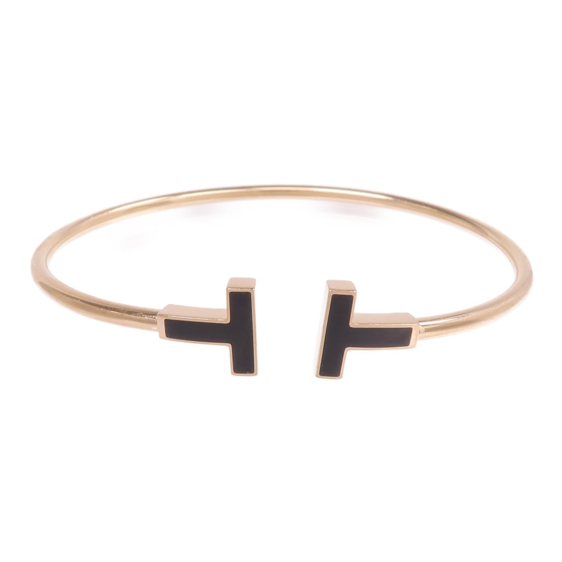 Tiffany Co T Wire Bracelet 18K Rose Gold Black Onyx: Tiffany Co T Wire Bracelet 18K Rose Gold Black Onyx Tiffany & Co. T Wire Bracelet in 18K pink gold and onyx black. This women's bracelet features a black and gold color combination and comes with a st