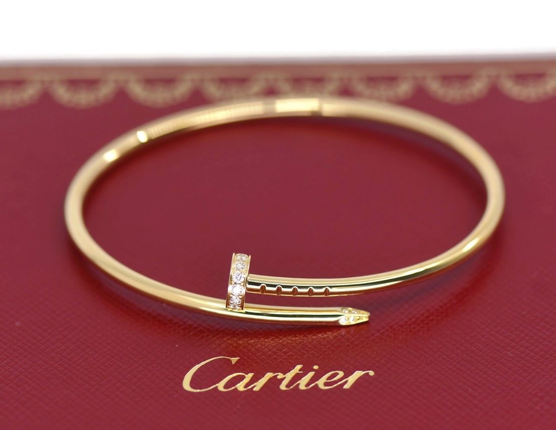 Cartier Juste un Clou SM 18K Yellow Gold Diamond Bangle 16: Cartier Juste un Clou SM 18K Yellow Gold Diamond Bangle 16 Cartier Juste un Clou SM diamond bracelet in 18K yellow gold, presented in a bangle style and size 16. The piece is identified as the small m