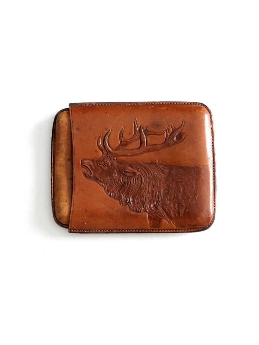 Vintage Alamo Leather Wallet with Stag Design: Vintage Alamo Leather Wallet with Stag Design Discover a unique piece of history with this vintage leather wallet, featuring a beautifully tooled stag design on one side. The reverse showcases the ins