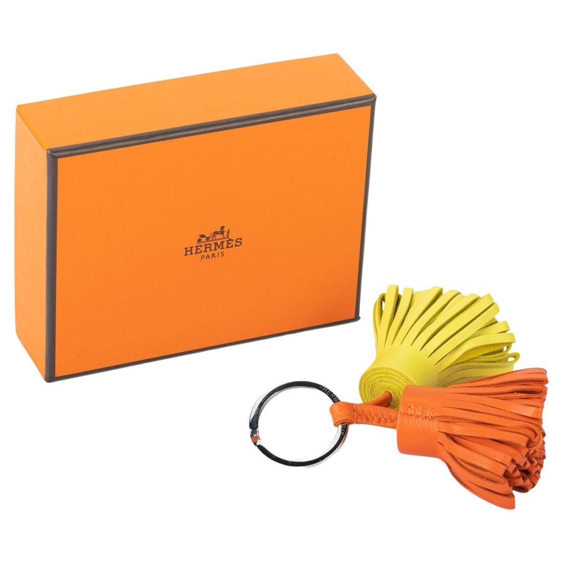 Hermes Double Carmen Bag Charm Key Chain BNIB Made in France: Hermes Double Carmen Bag Charm Key Chain BNIB Made in France Elevate your accessory collection with this exquisite Hermes Double Carmen Bag Charm. This charming piece doubles as a key chain, making it