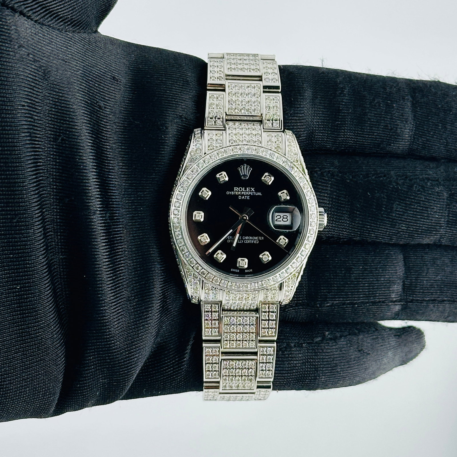 Rolex 115200 Aftermarket Black Diamond Dial Iced Out Oyster Bracelet Watch: Rolex 115200 Aftermarket Black Diamond Dial Iced Out Oyster Bracelet Watch This Rolex Oyster Perpetual Date features a striking Aftermarket black diamond dial and a pave diamond bezel, paired with an 