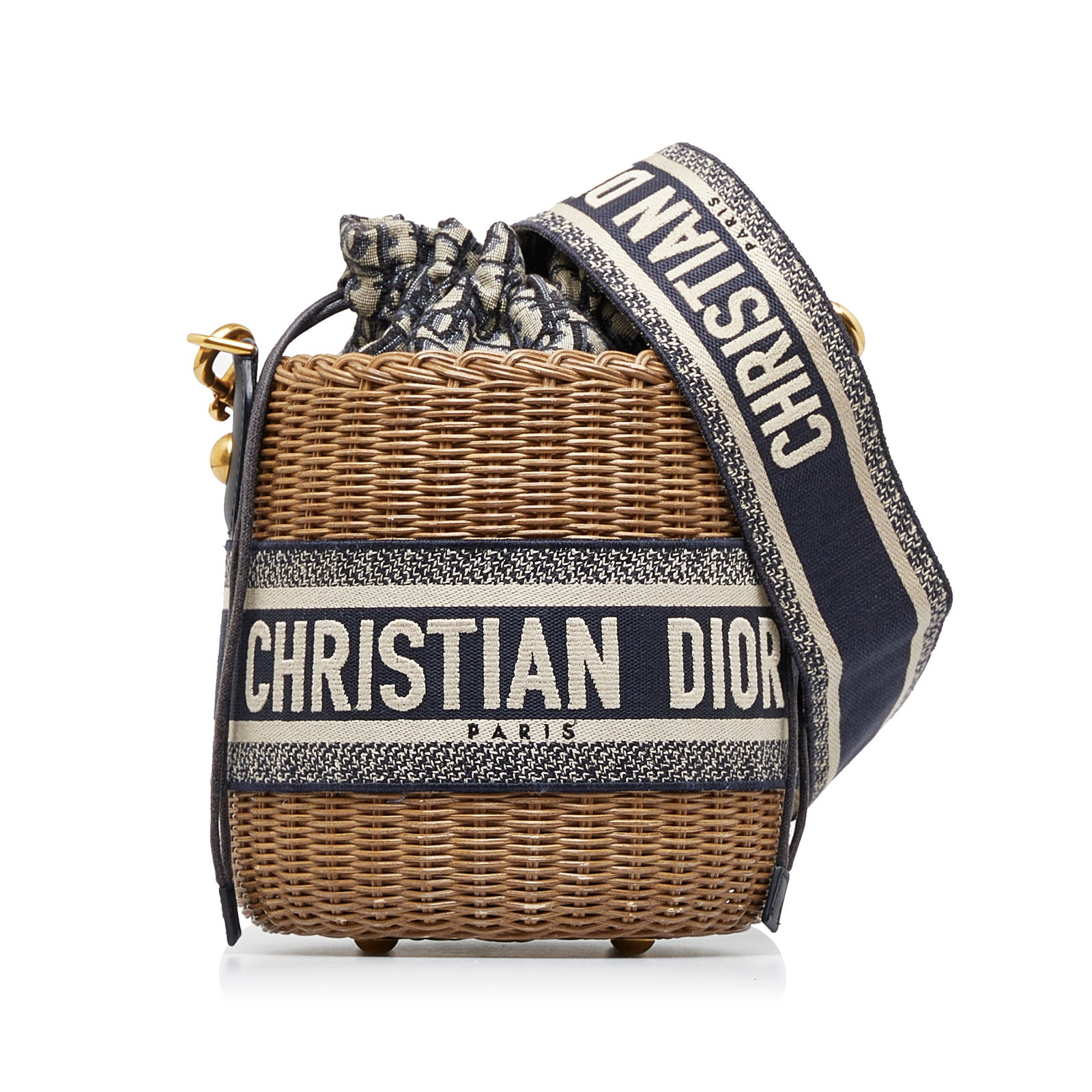 Dior Oblique Wicker Bucket Bag Brown Rattan with Dust Bag: Dior Oblique Wicker Bucket Bag Brown Rattan with Dust Bag The Dior Oblique Wicker Bucket Bag showcases a beautifully woven rattan body, offering a blend of style and practicality. It features a flat s