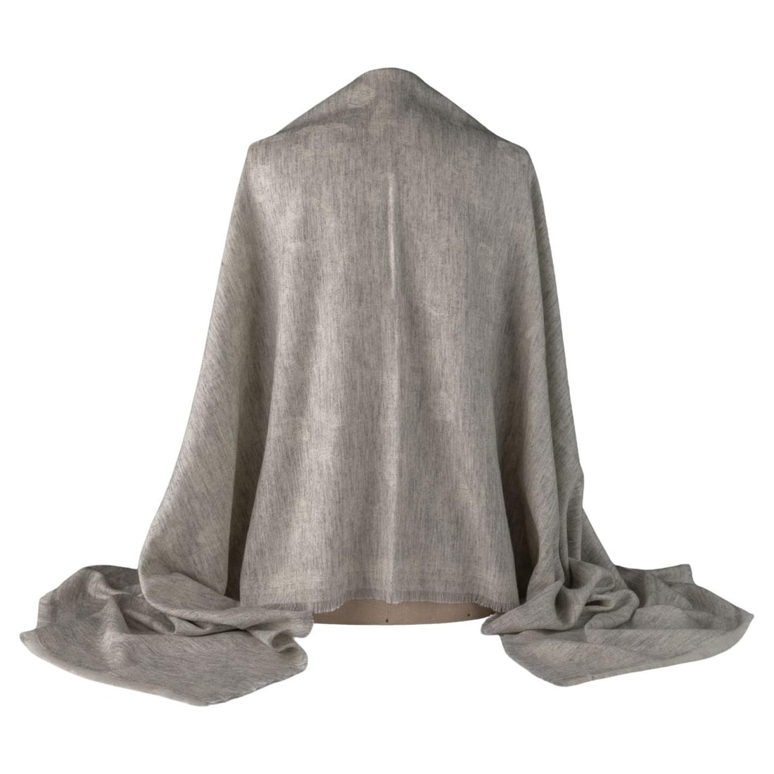 Chanel CC Logo Cashmere Fringe Shawl in Gray: Chanel CC Logo Cashmere Fringe Shawl in Gray Chanel shawl in grey cashmere with fringe trim and a tone-on-tone CC logo pattern throughout the fabric. Made in Italy, this 21st century piece is describe