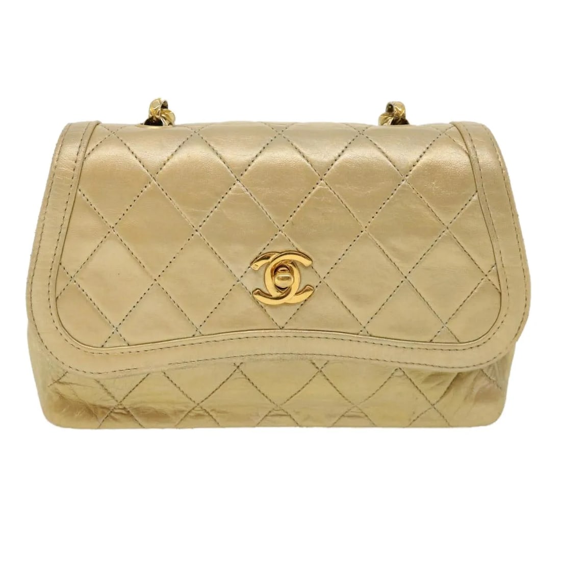 Chanel Vintage CC quilted lambskin flap bag: Chanel Vintage CC quilted lambskin flap bag This Chanel Vintage CC Chain Flap Bag is crafted from quilted lambskin leather in a gold color. Designed for women, it features the iconic CC turn-lock clos