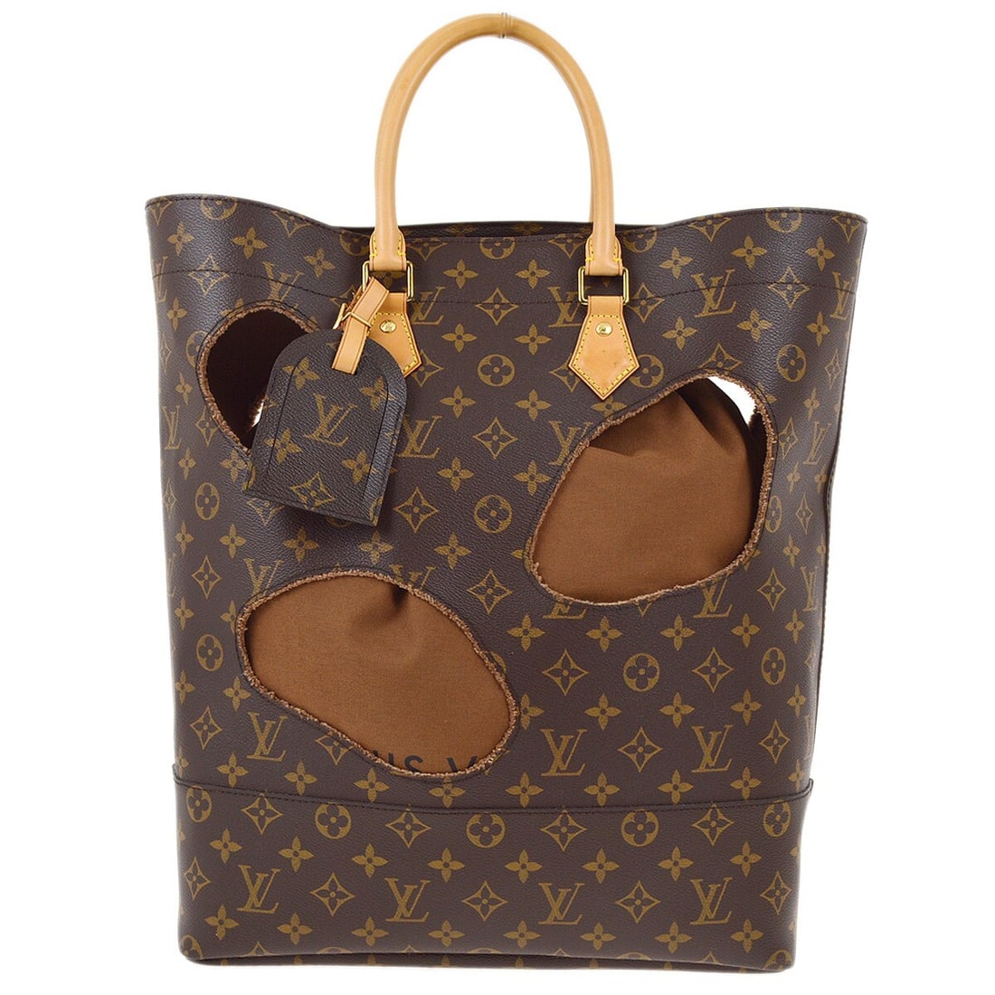 Louis Vuitton Comme des Garcons Bag With Holes Monogram Tote M40279: Louis Vuitton Comme des Garcons Bag With Holes Monogram Tote M40279 Louis Vuitton Bag With Holes tote bag from the Comme des Garcons collaboration in brown Monogram canvas and leather. This medium ope
