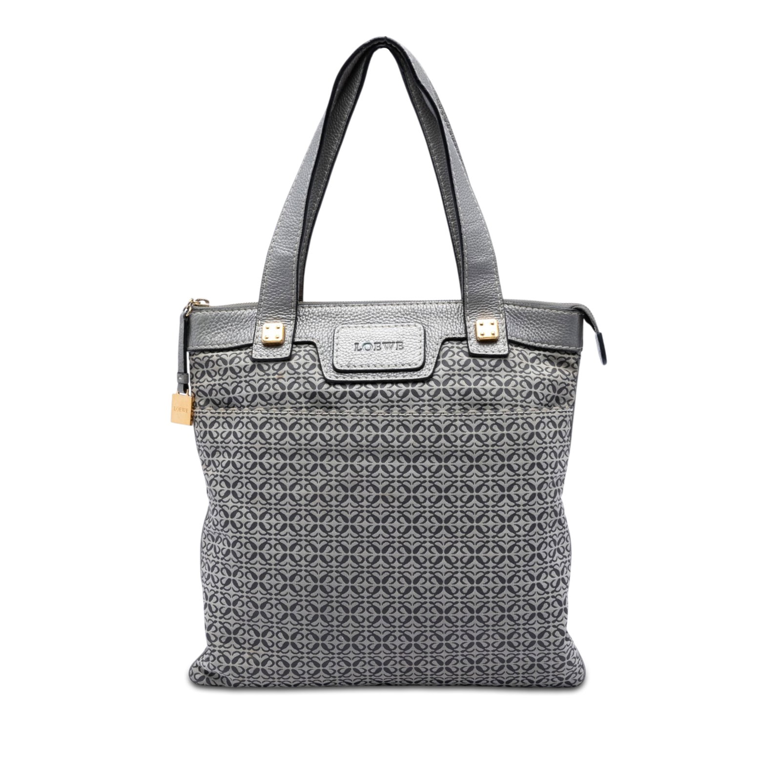 LOEWE Anagram Tote Bag in Gray Canvas with Leather Trim: LOEWE Anagram Tote Bag in Gray Canvas with Leather Trim LOEWE Anagram Canvas Tote in gray fabric with leather trim and flat leather straps. This tote features a top zip closure, exterior slip pockets,