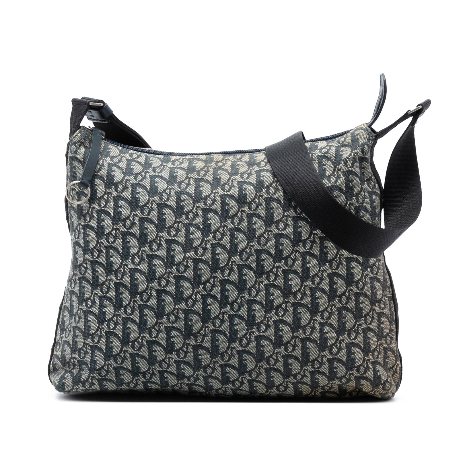 Dior Diorissimo Trotter Blue Canvas Adjustable Crossbody Bag: Dior Diorissimo Trotter Blue Canvas Adjustable Crossbody Bag This Diorissimo Trotter Canvas Crossbody bag features a blue canvas exterior with an adjustable flat shoulder strap, a top zip closure, and