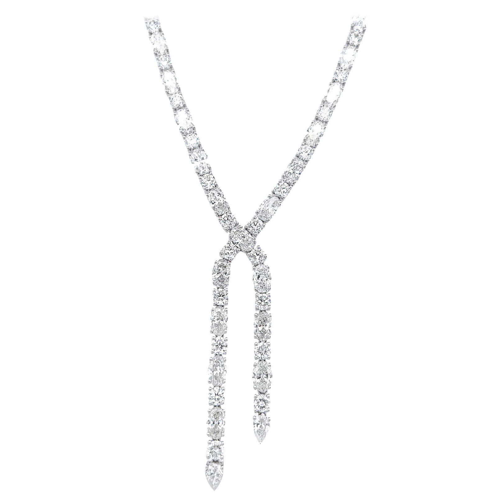 29.92ct Diamond Drop Necklace in 18k White Gold: 29.92ct Diamond Drop Necklace in 18k White Gold This exquisite 29.92ct Oval & Round Diamond Drop Tennis Necklace is a stunning piece crafted in 18k white gold. Featuring a contemporary design, it show