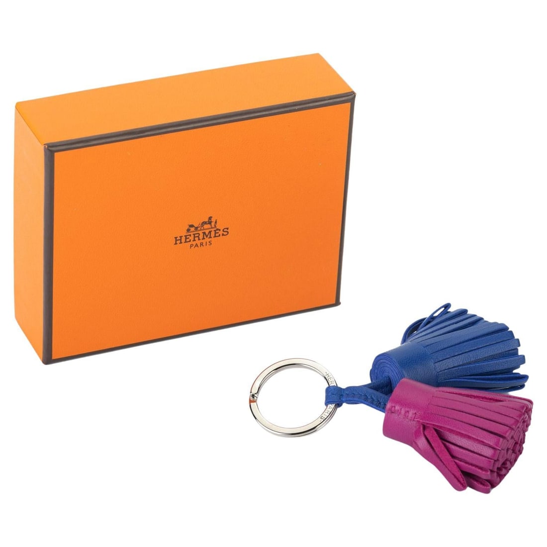 Hermes Double Carmen Bag Charm New in Box: Hermes Double Carmen Bag Charm New in Box This Hermes Double Carmen Bag Charm is a stylish accessory perfect for personalizing your bags or keys. Crafted in France, this charm features a unique design