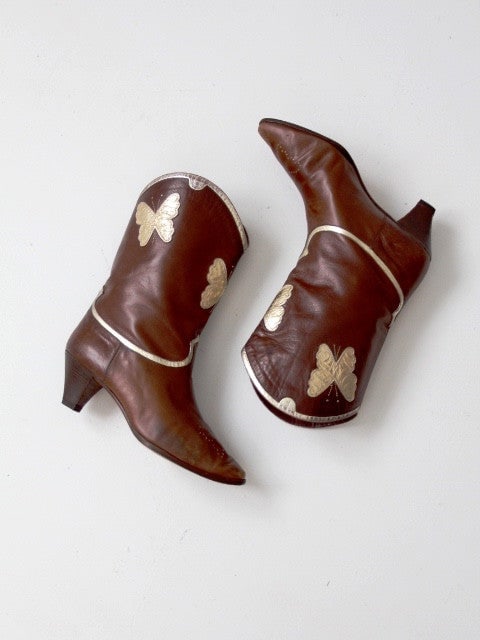 Vintage Di Fiori Italian Leather Butterfly Boots with Gold Details: Vintage Di Fiori Italian Leather Butterfly Boots with Gold Details Elevate your footwear collection with these Vintage Italian Leather Butterfly Boots. Crafted from buttery-soft chocolate brown leathe