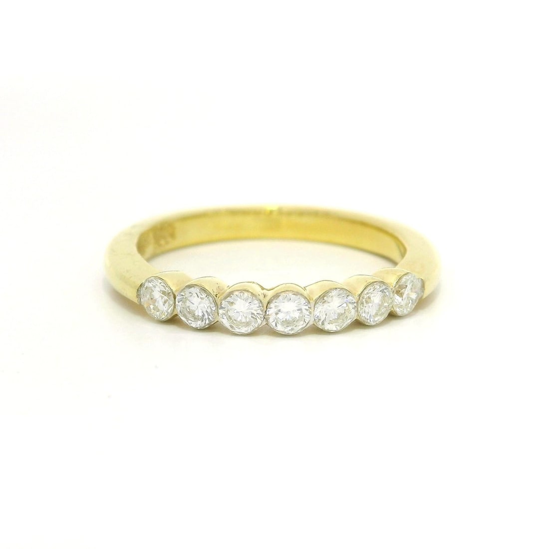 18k Yellow Gold 0.50ctw Natural Diamond 7 Stone Band Ring: 18k Yellow Gold 0.50ctw Natural Diamond 7 Stone Band Ring This exquisite 18k Yellow Gold band ring showcases a stunning arrangement of seven natural round brilliant cut diamonds, totaling approximatel
