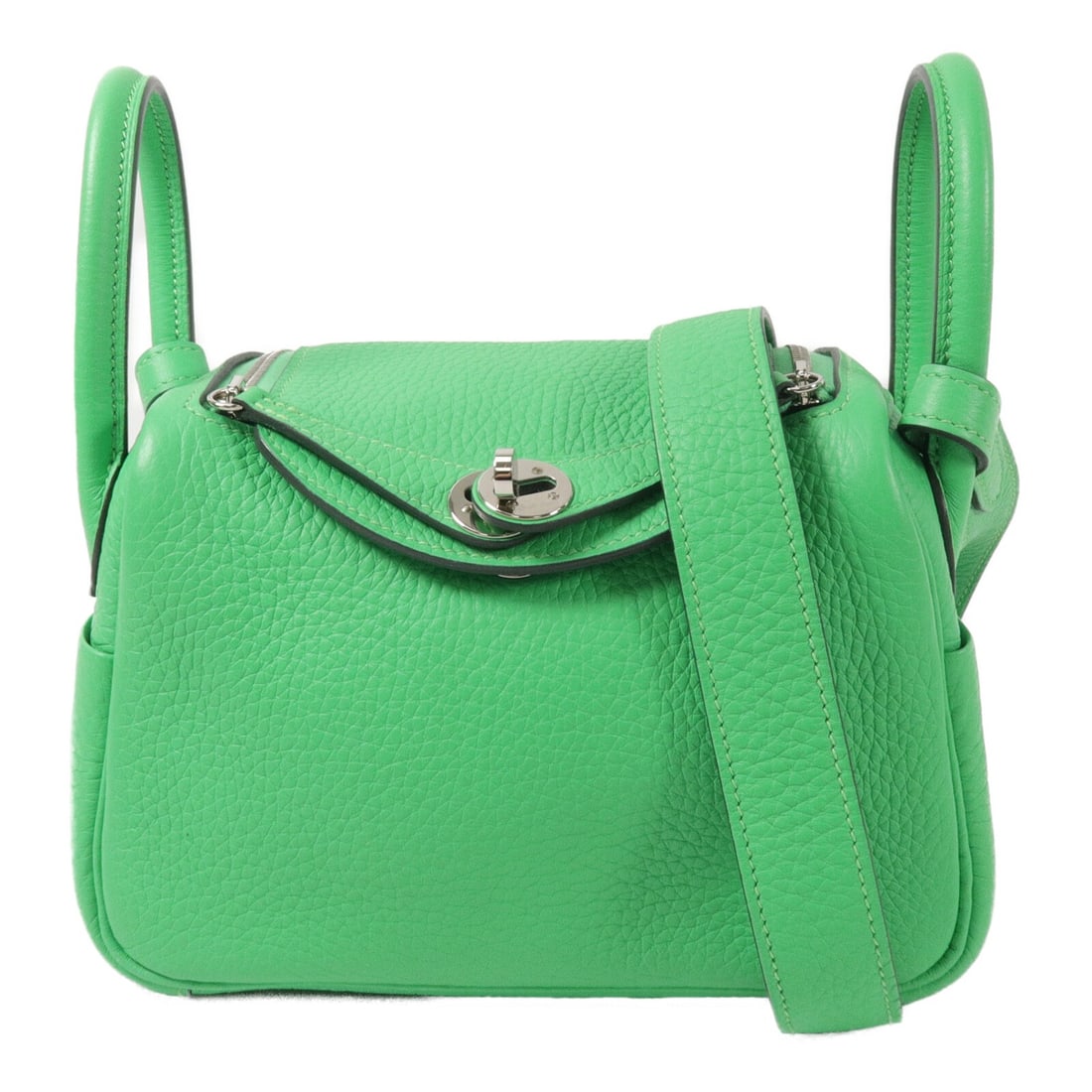 Hermes Mini Lindy Taurillon Clemence 2 Way Bag Vert Comics PHW: Hermes Mini Lindy Taurillon Clemence 2 Way Bag Vert Comics PHW A HERMES Mini Lindy 2 Way Shoulder Bag in Taurillon Clemence leather with calfskin details, presented in Vert Comics. It features a two-w