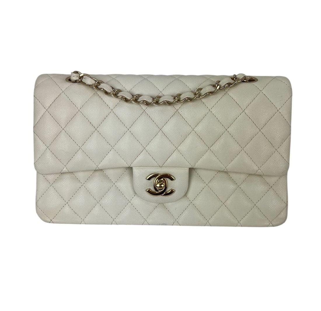 Chanel Classic Double Flap Caviar Quilted White Shoulder Bag: Chanel Classic Double Flap Caviar Quilted White Shoulder Bag This Chanel Caviar Quilted Medium Double Flap Shoulder Bag features a classic rectangular silhouette in white leather with an elegant quilt