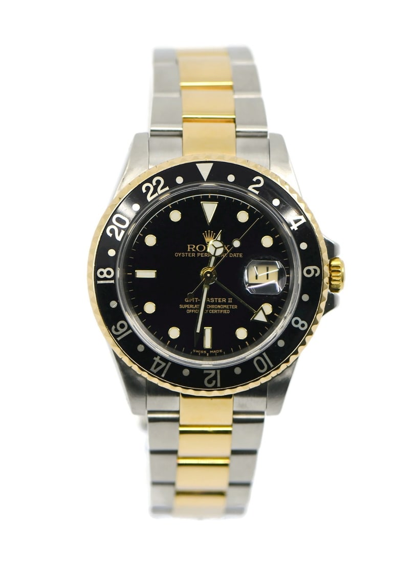 Rolex GMT-Master II 18K Stainless Steel Automatic Watch 16713 with Box and Papers: Rolex GMT-Master II 18K Stainless Steel Automatic Watch 16713 with Box and Papers This exquisite Rolex GMT-Master II wristwatch combines luxury and functionality. Crafted from a blend of 18K gold and 