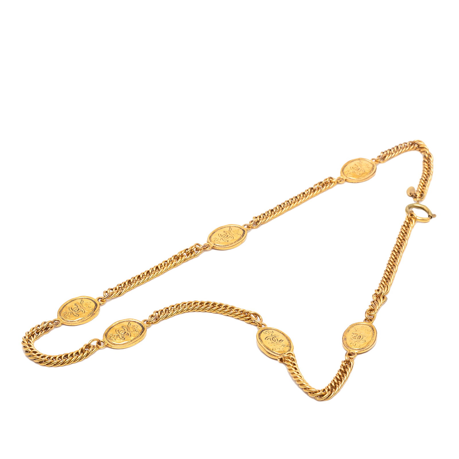 Chanel gold tone station necklace with crown medallion: Chanel gold tone station necklace with crown medallion This Chanel CC Gold Plated Crown Medallion Station Necklace features a gold-tone metal construction with a distinctive medallion design and a spr