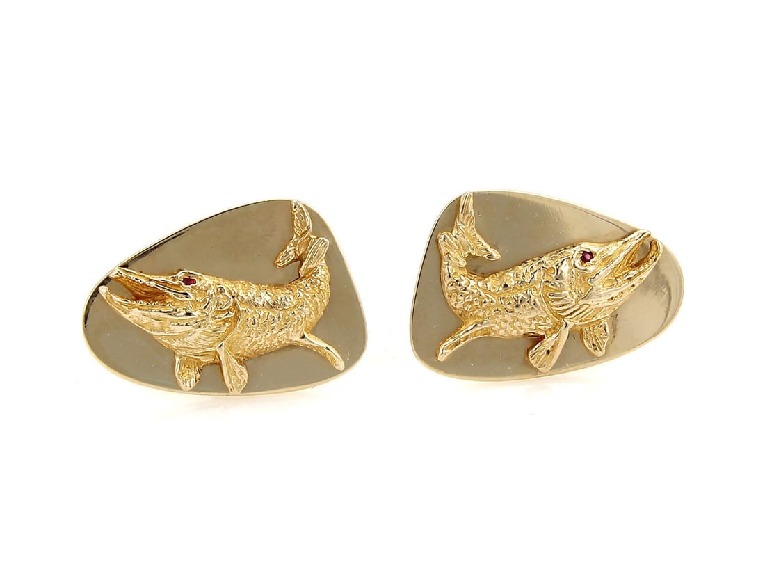 Tiffany Co Ruby Fish Cufflinks in 14k Yellow Gold: Tiffany Co Ruby Fish Cufflinks in 14k Yellow Gold Elegant fish cufflinks crafted in 14k yellow gold and accented with rubies. The sculptural, dimensional design offers a refined vintage look with dist
