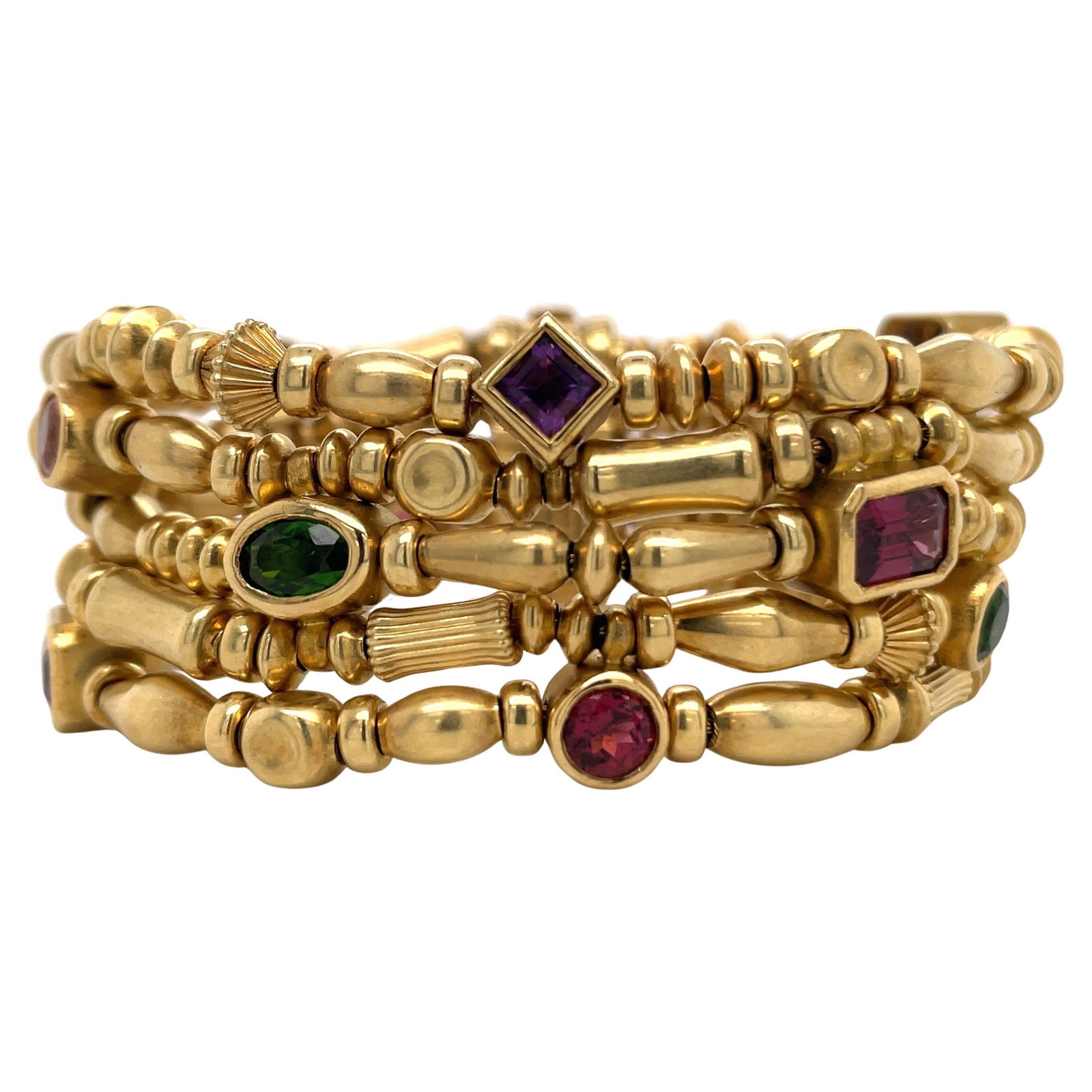 Seidengang Five Row Bracelet 18K Yellow Gold Multi-Color Gemstones: Seidengang Five Row Bracelet 18K Yellow Gold Multi-Color Gemstones This exquisite five-row beaded bracelet by Seidengang showcases a stunning array of multi-colored gemstones, including emerald, garne