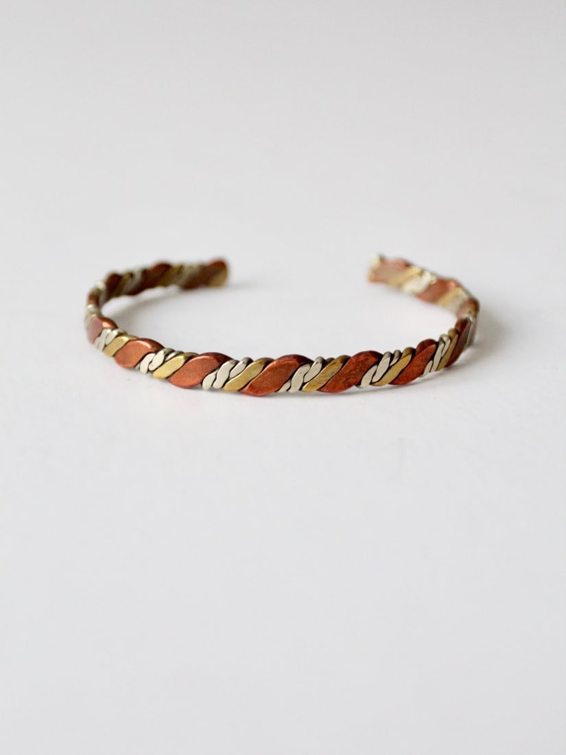 1970s Vintage Mexican Cuff Bracelet Mixed Metal Copper Brass Silver: 1970s Vintage Mexican Cuff Bracelet Mixed Metal Copper Brass Silver Discover a stunning piece of craftsmanship with this vintage Mexican mixed metal cuff bracelet from the 1970s. Made from a blend of 