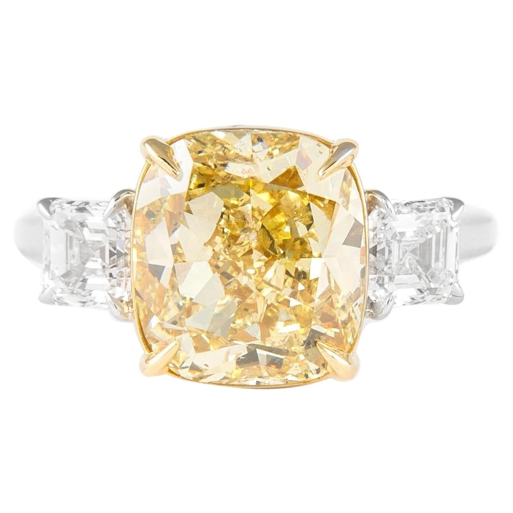 GIA Certified 5.03ct Fancy Yellow Diamond Three-Stone Ring 18k Two-Tone: GIA Certified 5.03ct Fancy Yellow Diamond Three-Stone Ring 18k Two-Tone This exquisite three-stone ring features a stunning GIA certified fancy yellow diamond at its center, weighing 5.03 carats and e