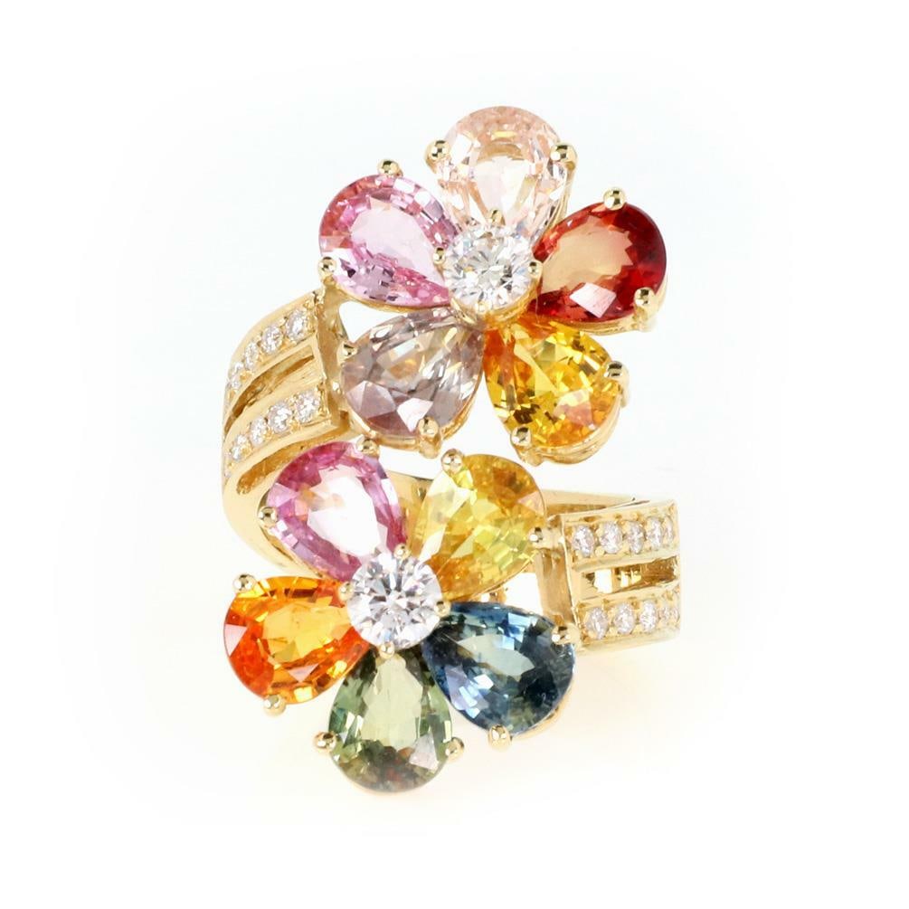 18k Yellow Gold Floral Bypass Ring with Sapphire and Diamond: 18k Yellow Gold Floral Bypass Ring with Sapphire and Diamond This elegant estate bypass ring is crafted from 18k yellow gold and features a floral design. The ring showcases pear-shaped multicolor sap