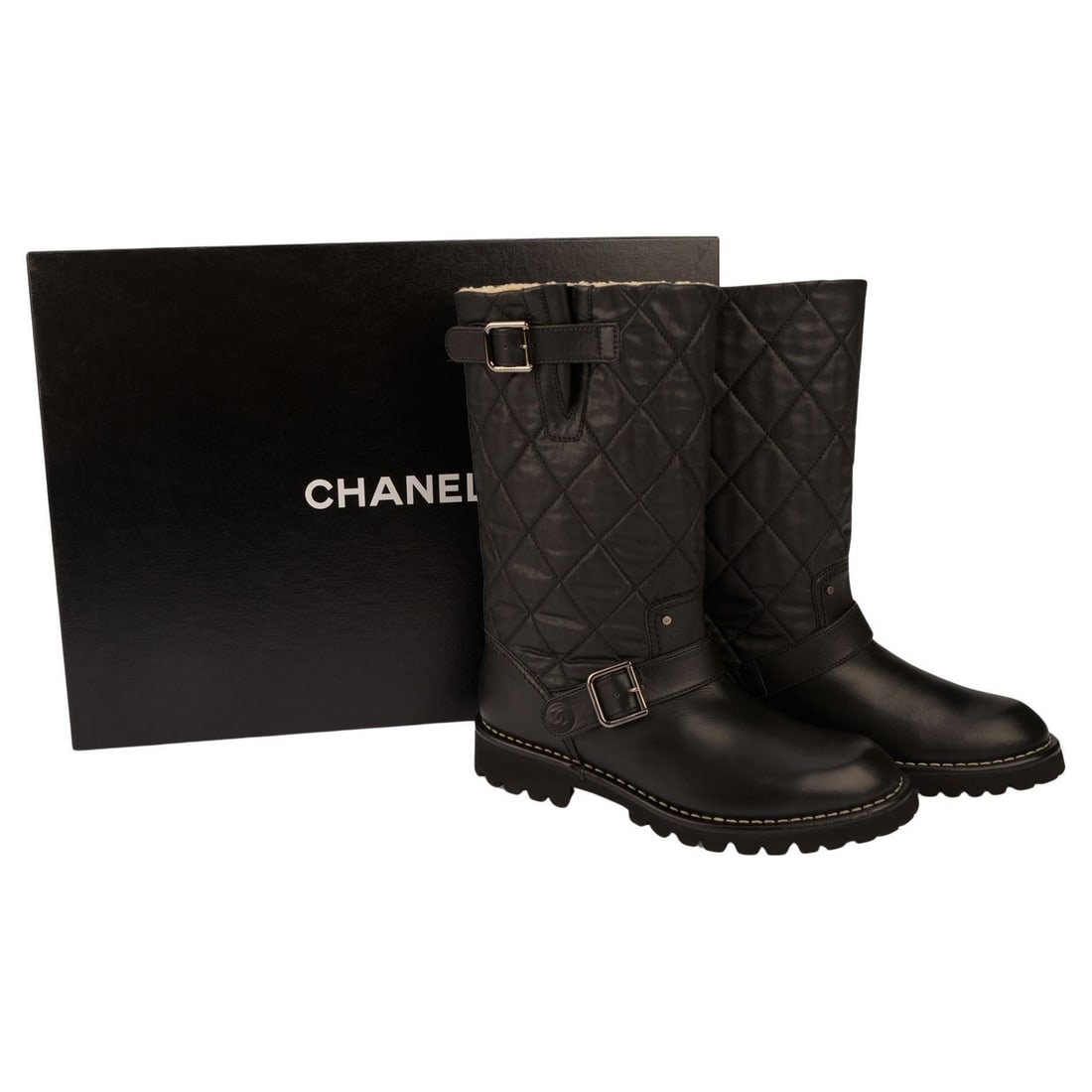 Chanel Shearling Lined Quilted Leather Moto Boots Size 38 Italy: Chanel Shearling Lined Quilted Leather Moto Boots Size 38 Italy Chanel quilted leather biker boots featuring a mid-calf shaft, adjustable side buckle closures, and a shearling lining. Designed with a 