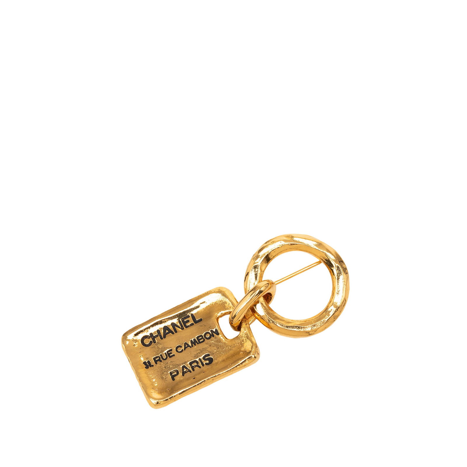Chanel 31 Rue Cambon Tag Gold Plated Brooch: Chanel 31 Rue Cambon Tag Gold Plated Brooch Gold plated Chanel 31 Rue Cambon tag brooch with a back pin closure. Made in France, this costume jewelry piece has a gold-tone look and shows visible wear 