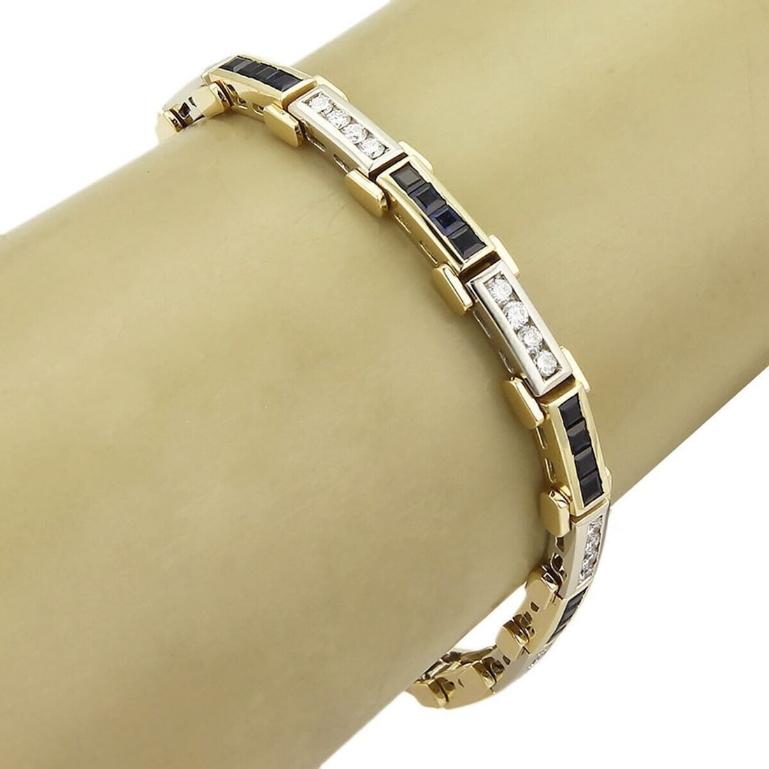 18k Yellow White Gold Bar Link Bracelet with Diamonds and Sapphires: 18k Yellow White Gold Bar Link Bracelet with Diamonds and Sapphires This vintage estate bar link bracelet is crafted in 18k yellow and white gold and features diamonds accented with sapphires. It has 