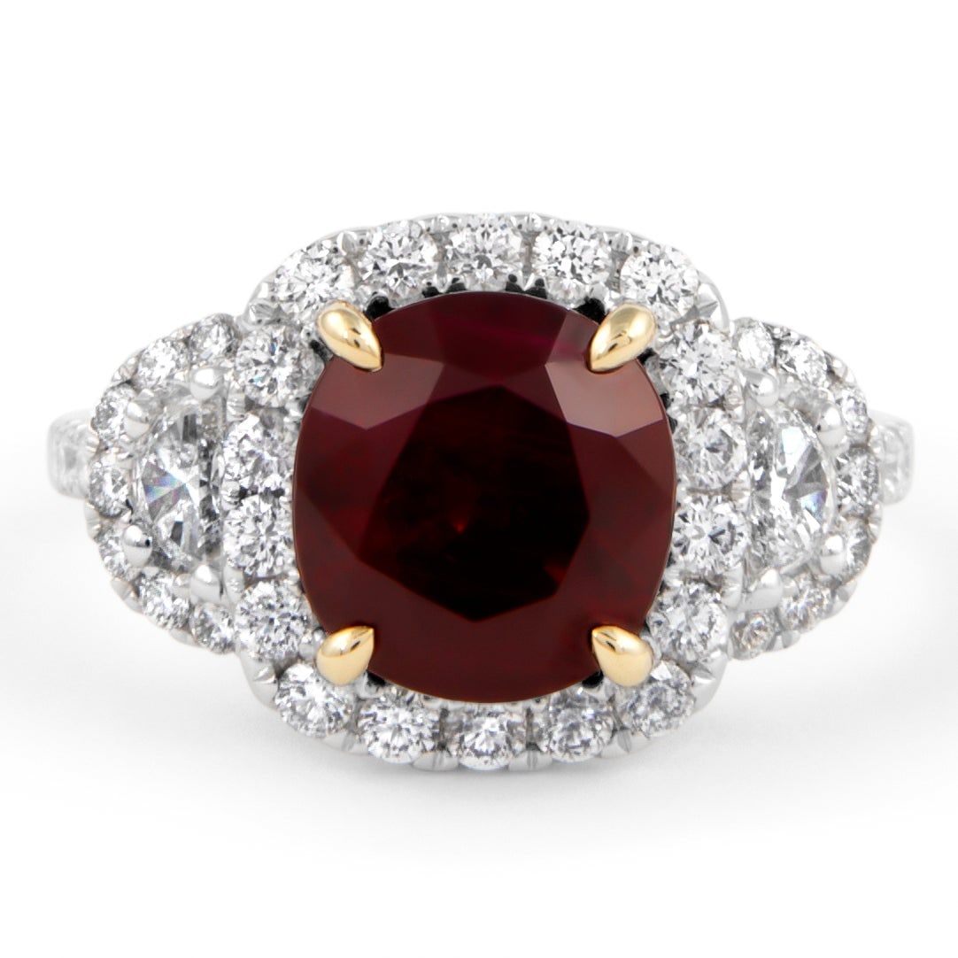 GIA 4.13ct Ruby Diamond Halo Ring 18k Gold: GIA 4.13ct Ruby Diamond Halo Ring 18k Gold This exquisite 3-stone halo ring features a stunning GIA certified 4.13 carat oval-shaped ruby, known for its vibrant 'pigeon blood' color, set in a luxuriou