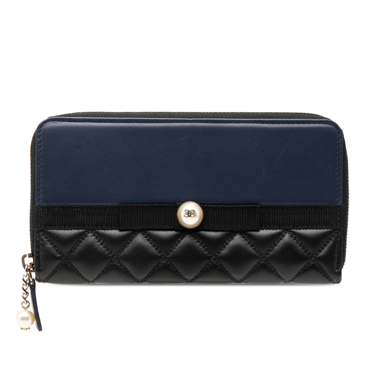 Chanel Faux Pearl Ribbon Zip Around Long Wallet in Bicolor Lambskin: Chanel Faux Pearl Ribbon Zip Around Long Wallet in Bicolor Lambskin Bicolor quilted lambskin long wallet with faux pearl ribbon embellishment and a zip-around closure. The interior includes zip and sl