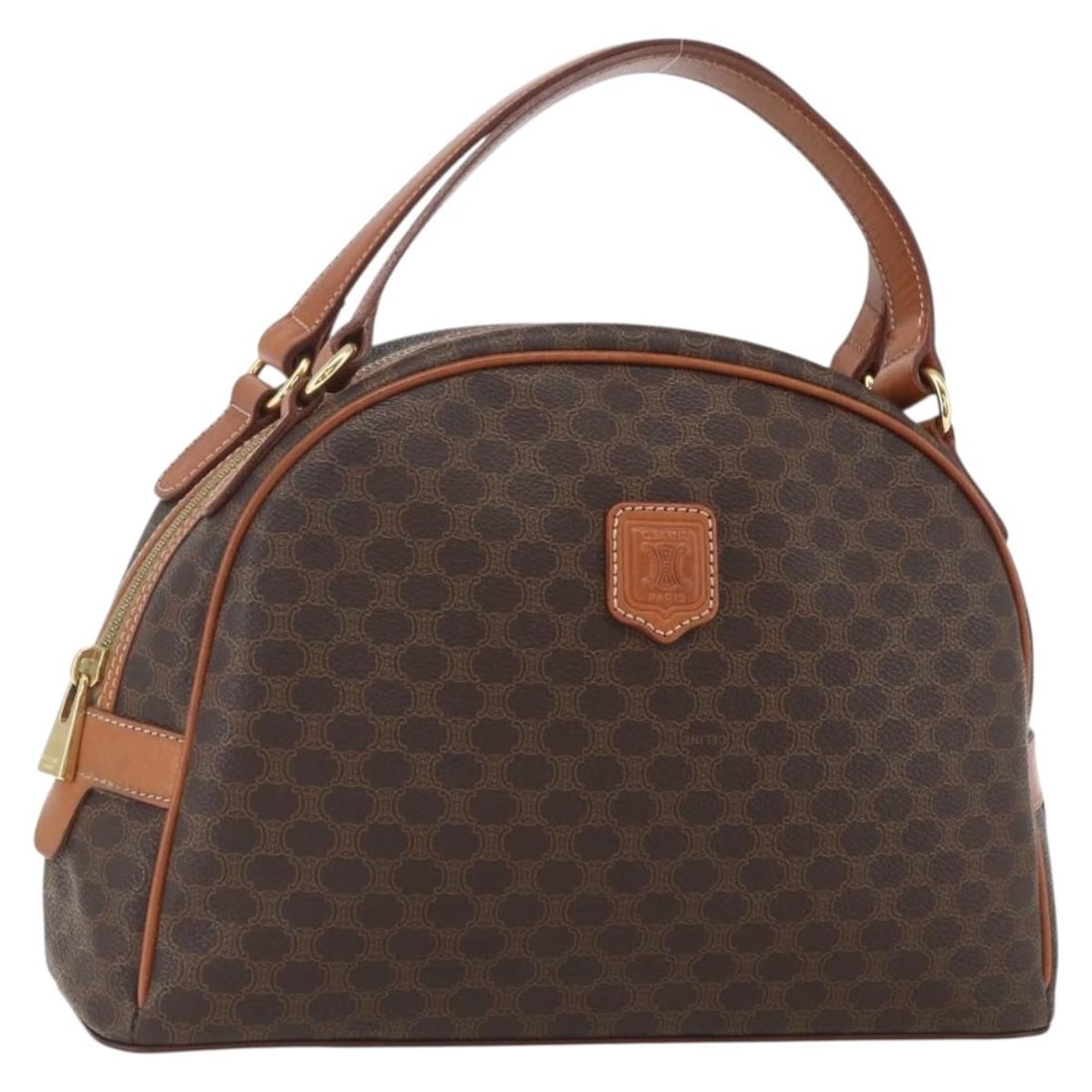 Brown Macadam Canvas PVC Leather Handbag by CELINE Gold Tone Accents: Brown Macadam Canvas PVC Leather Handbag by CELINE Gold Tone Accents This CELINE Macadam hand bag features brown and gold PVC leather with gold-tone accents. Made in Italy, the bag offers a classic si