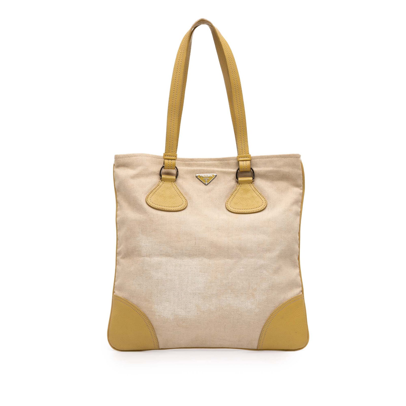 Prada Canapa Canvas Tote with Leather Trim Beige Handbag: Prada Canapa Canvas Tote with Leather Trim Beige Handbag This Prada Vitello Trimmed Canvas Canapa Tote features a beige canvas body with leather trim and flat leather handles. The open top has a snap 