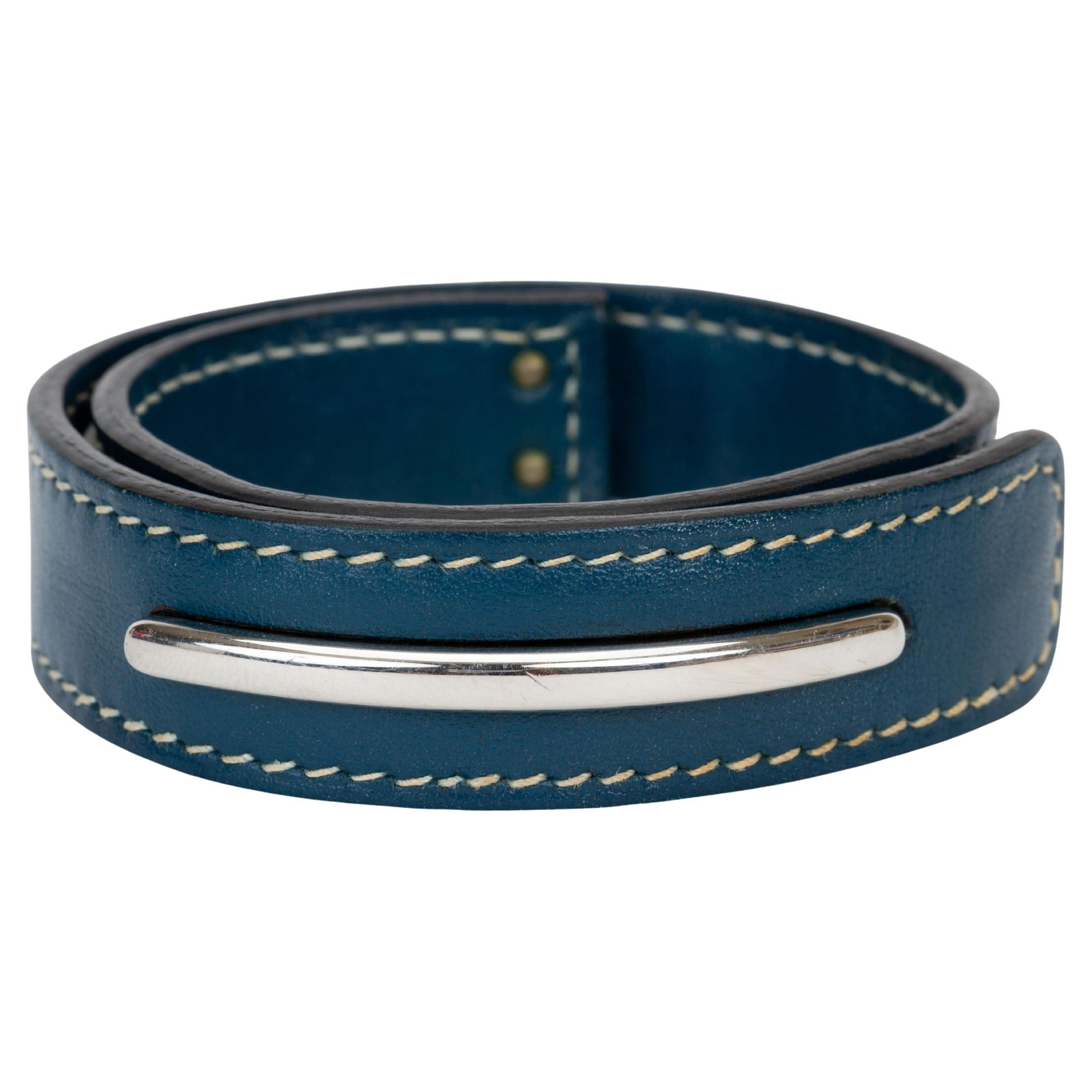 Hermes blue leather bracelet with silver tone clasp: Hermes blue leather bracelet with silver tone clasp This Hermes bracelet is crafted from blue Chamonix leather with contrast white stitching and is finished with a silver-toned closure. The bracelet i